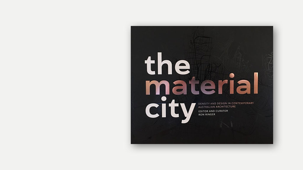 A photograph of the book 'The Material City' edited by Ron Ringer.