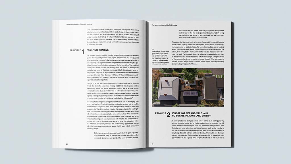 A photograph of the book 'Bluefield Housing as Alternative Infill for the Suburbs' by Damian Madigan, showing the book open to pages 92 and 93.